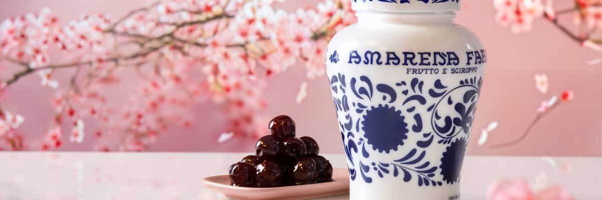 Fabbri Amarena cherries in iconic blue and white jar with syrupy Italian cherries served on a plate, Mother’s Day food gift idea Fabbri Amarena cherries in iconic blue and white jar with syrupy Italian cherries served on a plate, Mother’s Day food gift idea