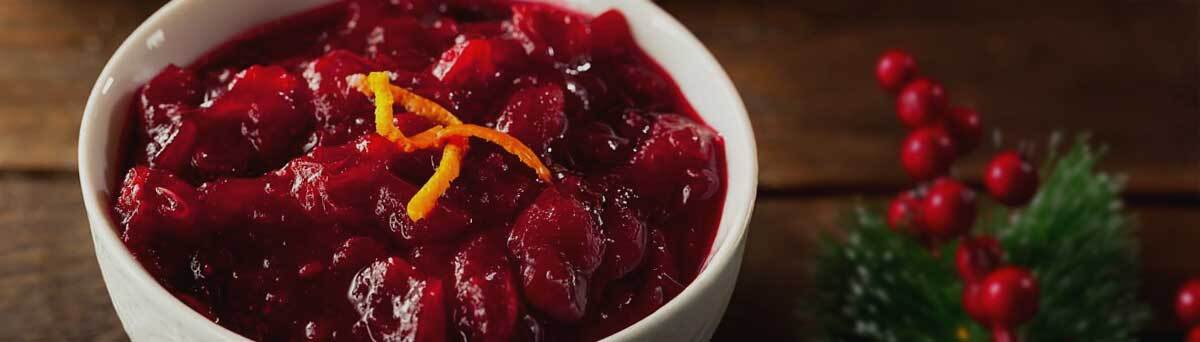 Stokes-Cranberry-Sauce-in-a-bowl-with-orange-peel-garnish-at-Christmas Stokes-Cranberry-Sauce-in-a-bowl-with-orange-peel-garnish-at-Christmas